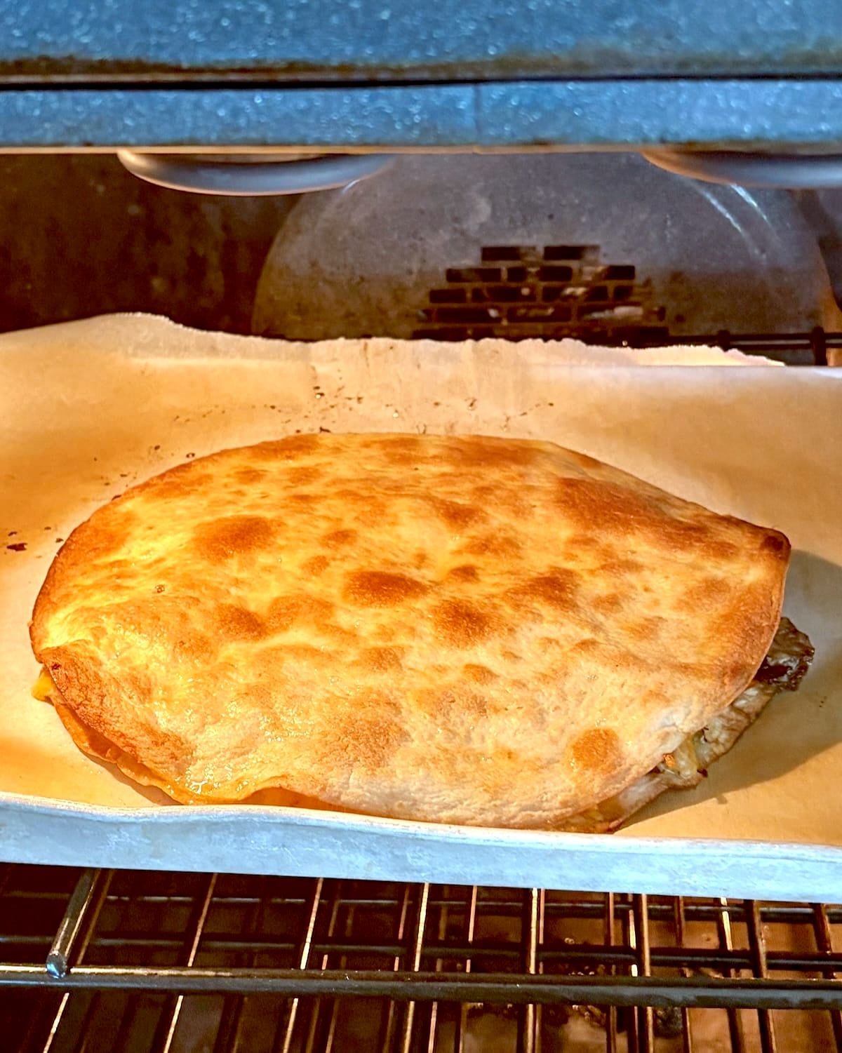 Slicing the quesadillas with a pizza cutter.