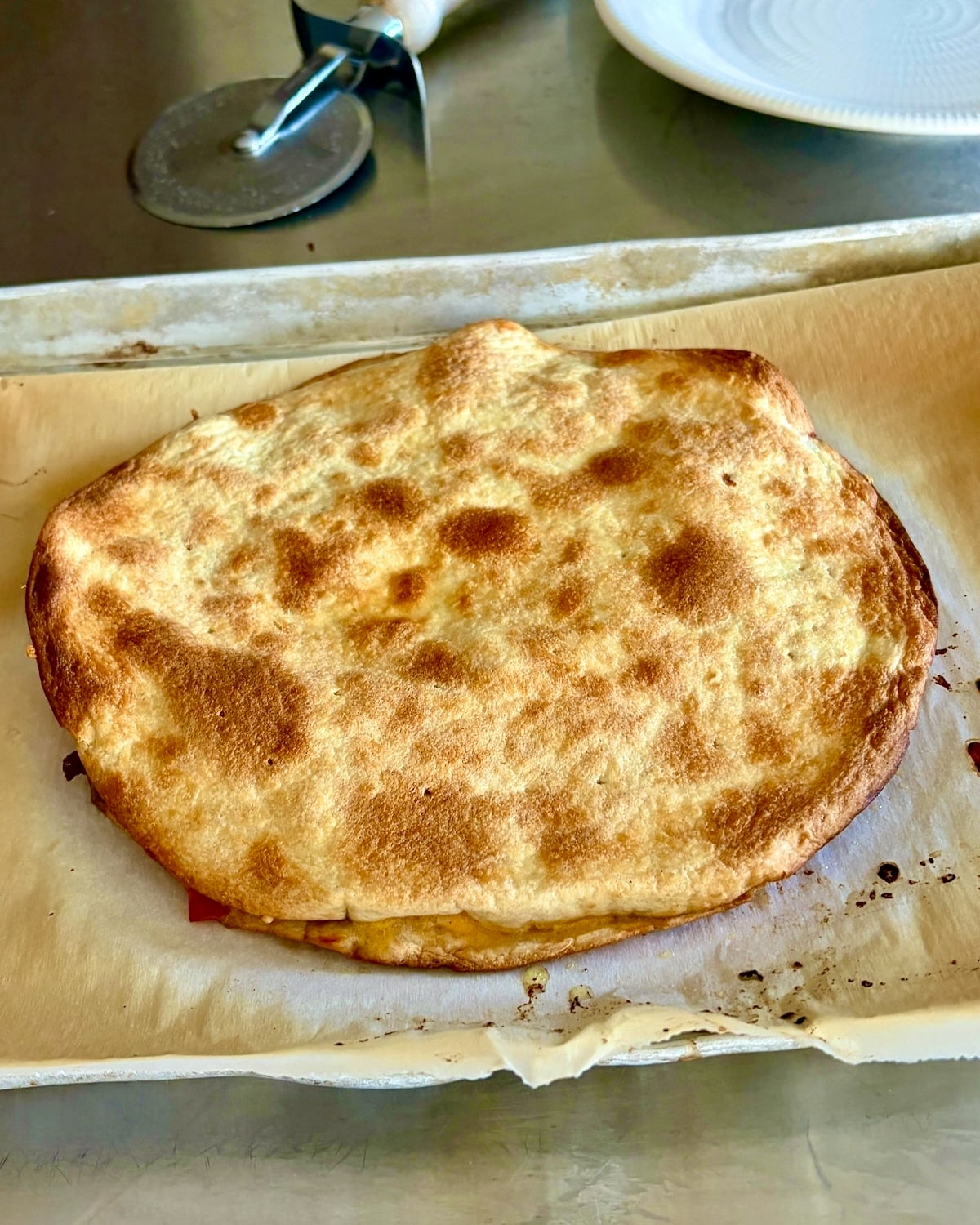 Remove quesadilla from oven.