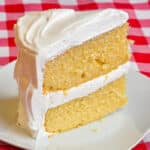 The best vanilla cake, single slice on white plate.