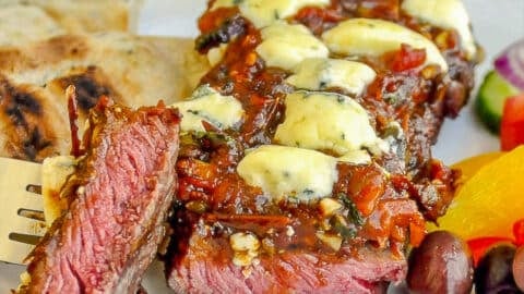 Blue Cheese Steak Puttanesca cut to show medium rare inside