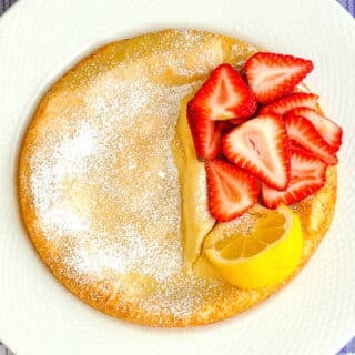 Dutch Baby over head photo on a white plate