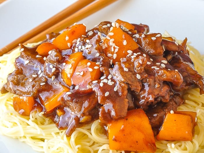 Five Spice Ginger Beef close up image served on thin noodles