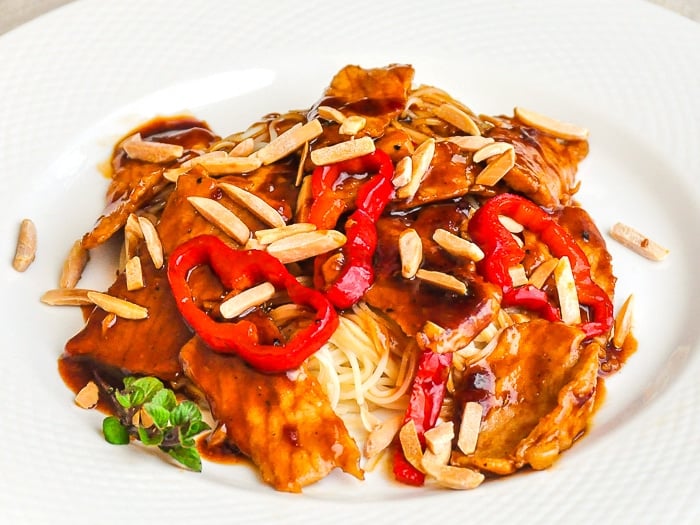 Kung Pao Pork photo of one serving on a white plate