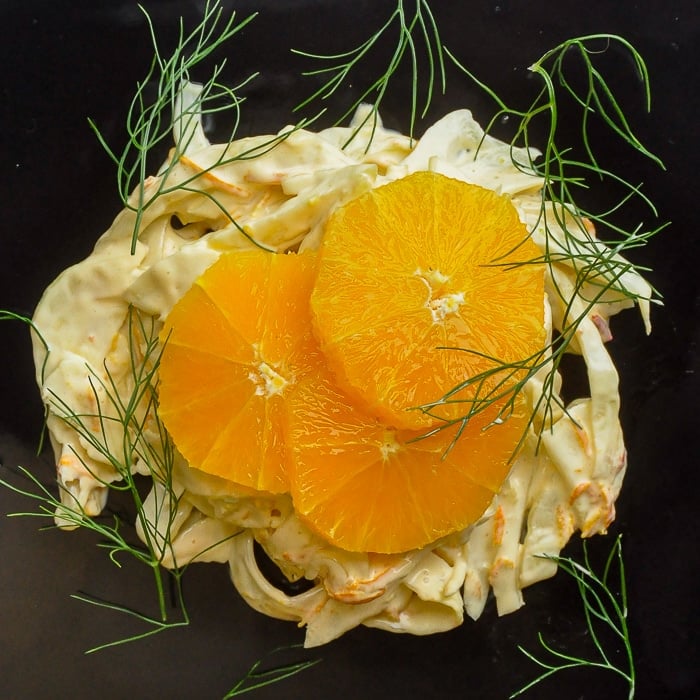 Spicy Orange Fennel Salad overhead photo of one serving on a black plate