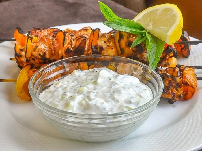 Chicken Souvlaki with Lemon Mint Tzatziki on a white plate