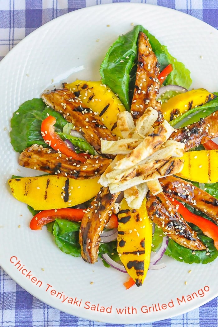 Chicken Teriyaki Salad with Grilled Mango photo of a single serving with title text added for Pinterest