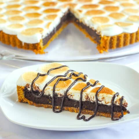 One slice of Smores Tart on a white plate