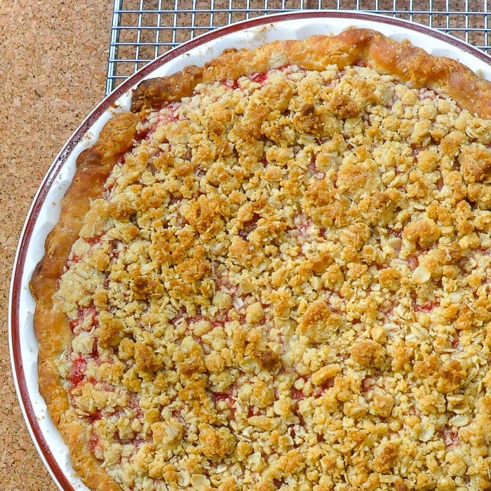Strawberry Rhubarb Pie with Oatmeal Crumble Topping close up photo of top of pie