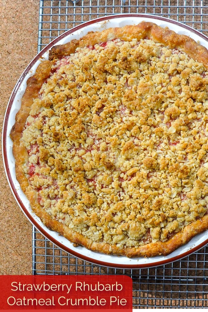 Strawberry Rhubarb Pie with Oatmeal Crumble Topping photo of uncut pie with title text added for Pinterest