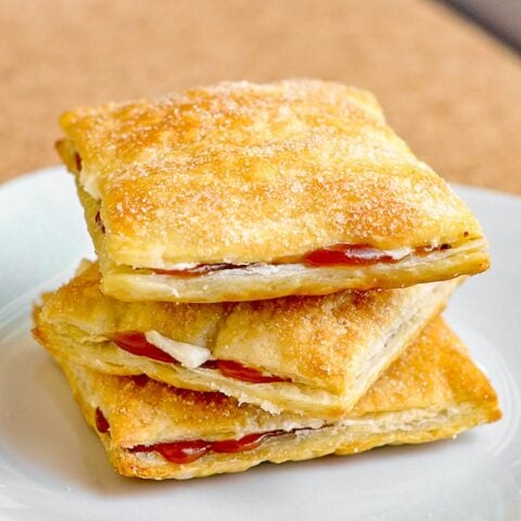 Vanilla Caramel Puff Pastries photo of 3 pastries stacked on a white plate