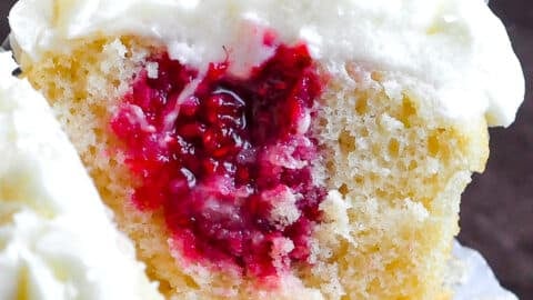 Raspberry Vanilla Cream Cheese Cupcakes close up photo of inside of cupcake