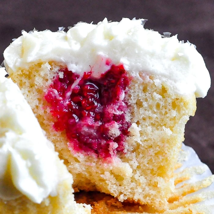 Raspberry Vanilla Cream Cheese Cupcakes close up photo of inside of cupcake