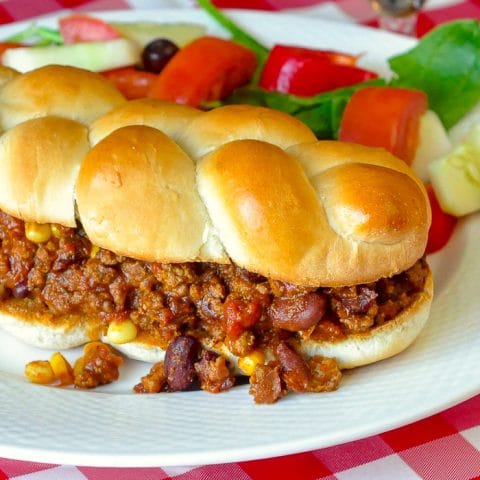 Chipotle Chili Sloppy Joes close up photo of a single sandwich on a white plate