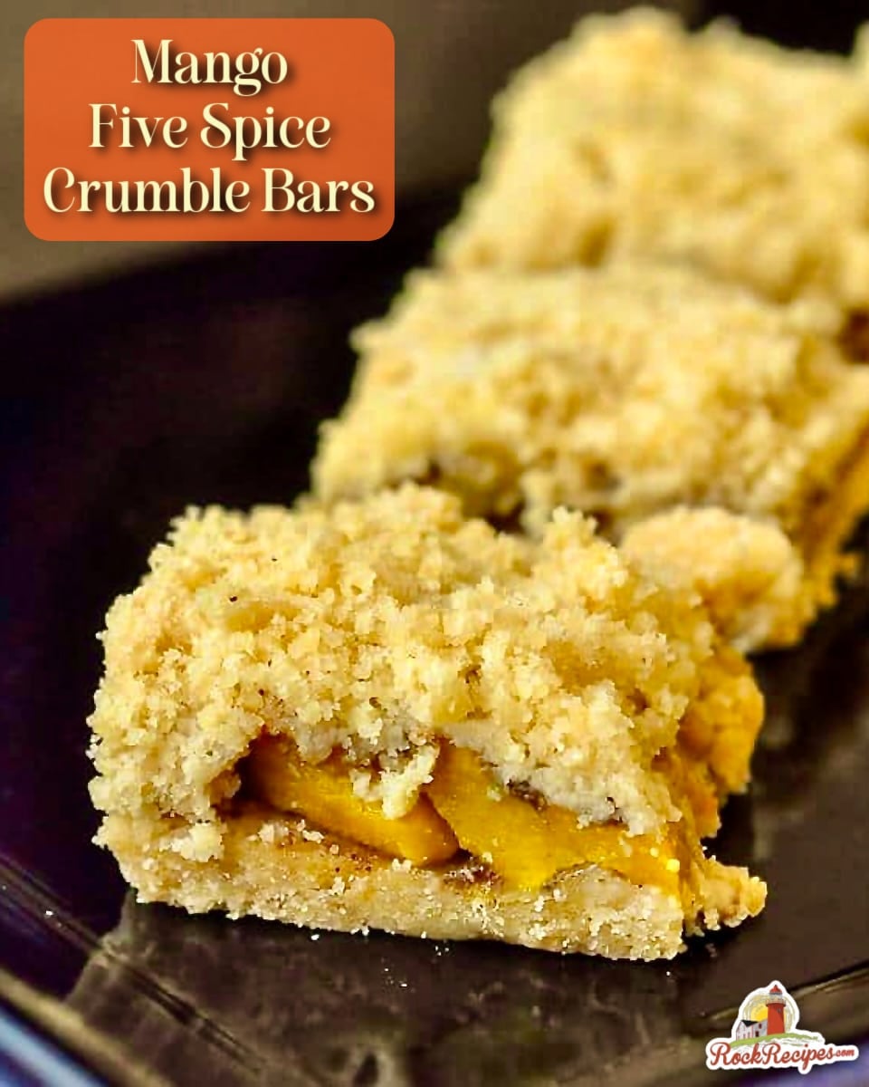 Mango Five Spice Crumble Bars shown on a black serving plate with title text added for Pinterest and social media posts.