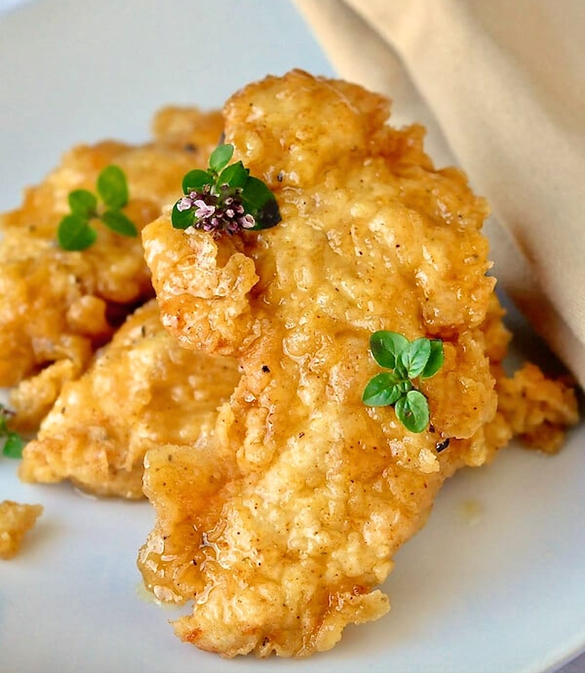 Honey Dijon Boneless Wings close up photo of one boneless chicken wing.