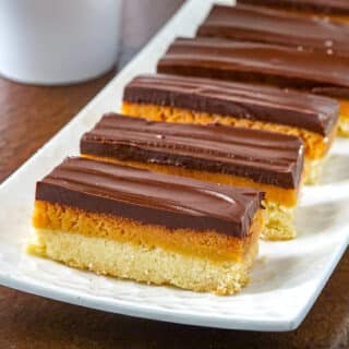 Twix Cookies on a white serving plate.