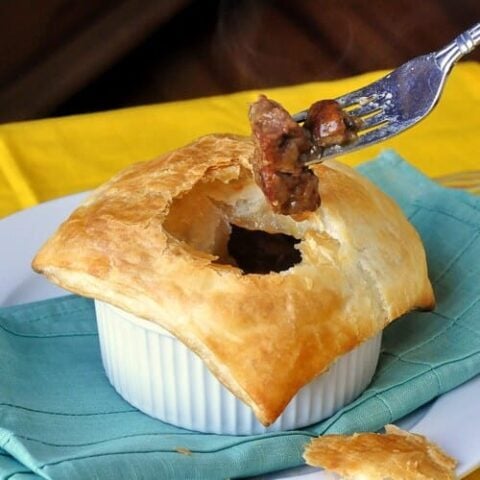 Easy Steak and Onion Pie photo with fork in pie