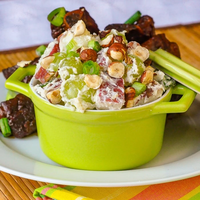 Lemon Waldorf Potato Salad in a single serving green dish