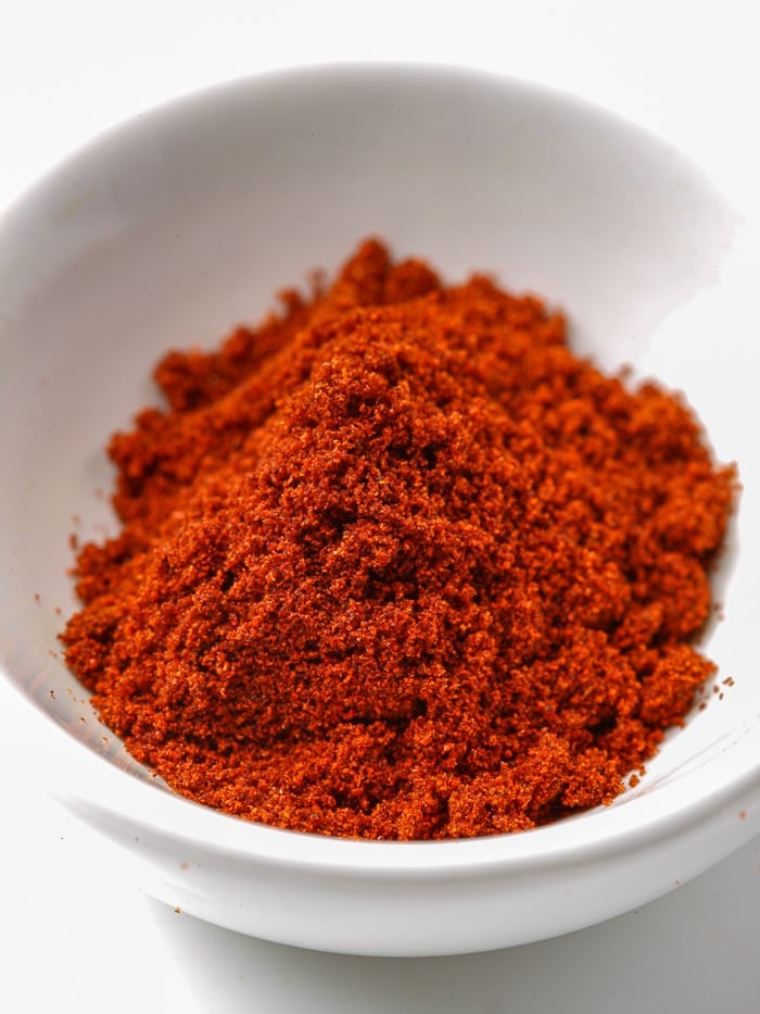 Chipotle powder in a white bowl. Stock image.