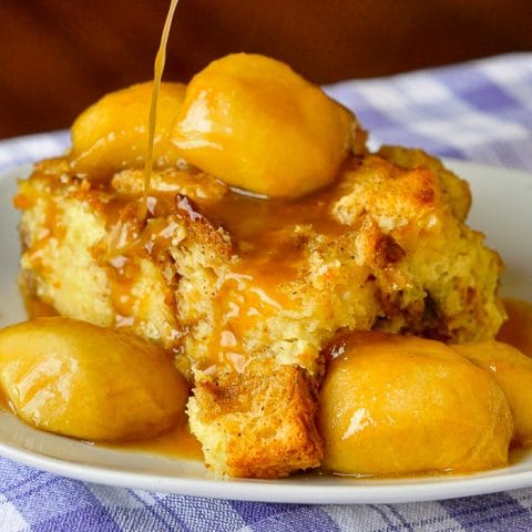 Maple Apple Bread Pudding close up photo of a single serving on a white plate