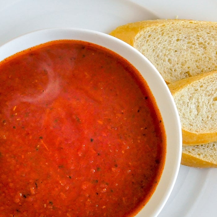 Roasted Tomato Fennel Soup close up shot of soup in white bowl