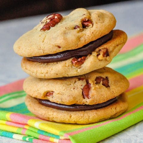 Pecan Chocolate Sandwich Cookies close up photo of two cookies stacked.