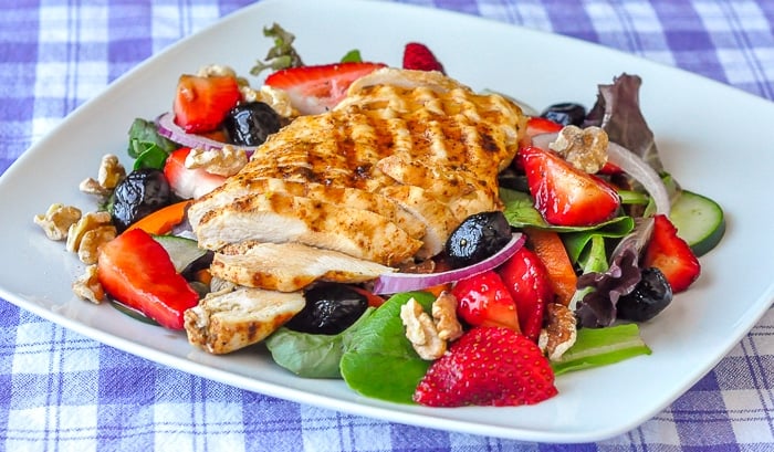 Strawberry Balsamic Salad entire serving, wide shot photo on white plate