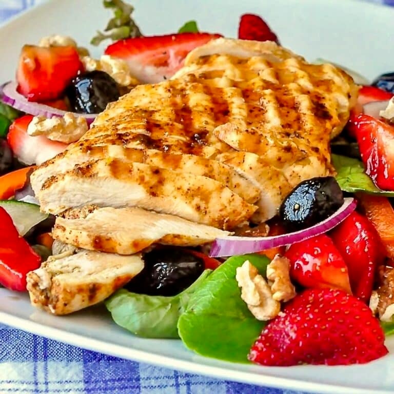 Strawberry Balsamic Salad close up photo on white plate.