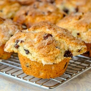 The Best Chocolate Chip Muffins close up of a single muffin on wire cooling rack