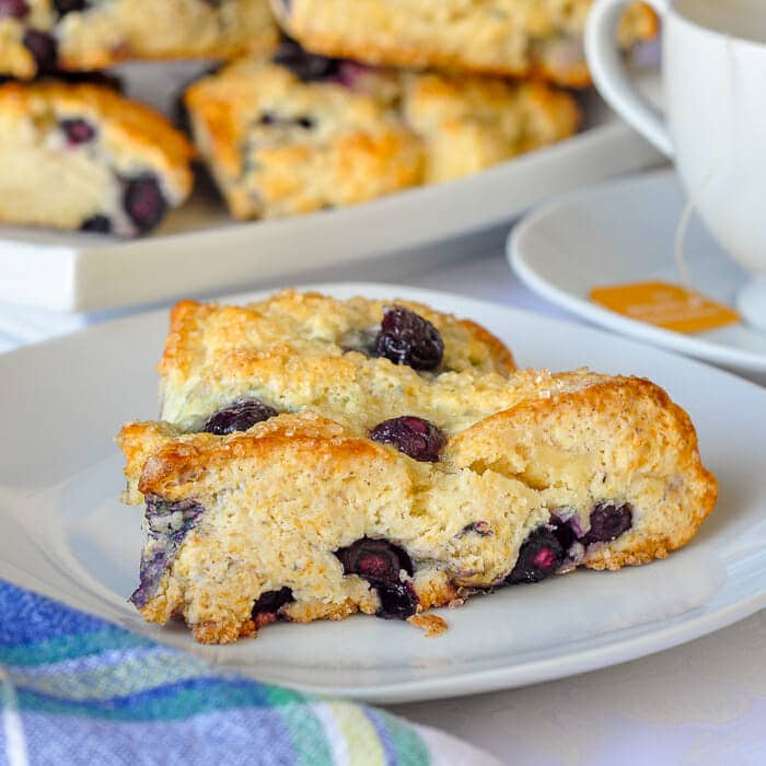 Blueberry Cheesecake Scones on a white plate.