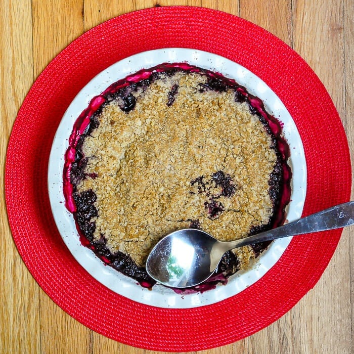 Bumbleberry Crumble wide shot of baked dessert in deep dish pie pan