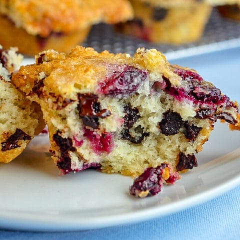 Chunky Cherry Chocolate Chip Muffins showing interior of cut muffin.