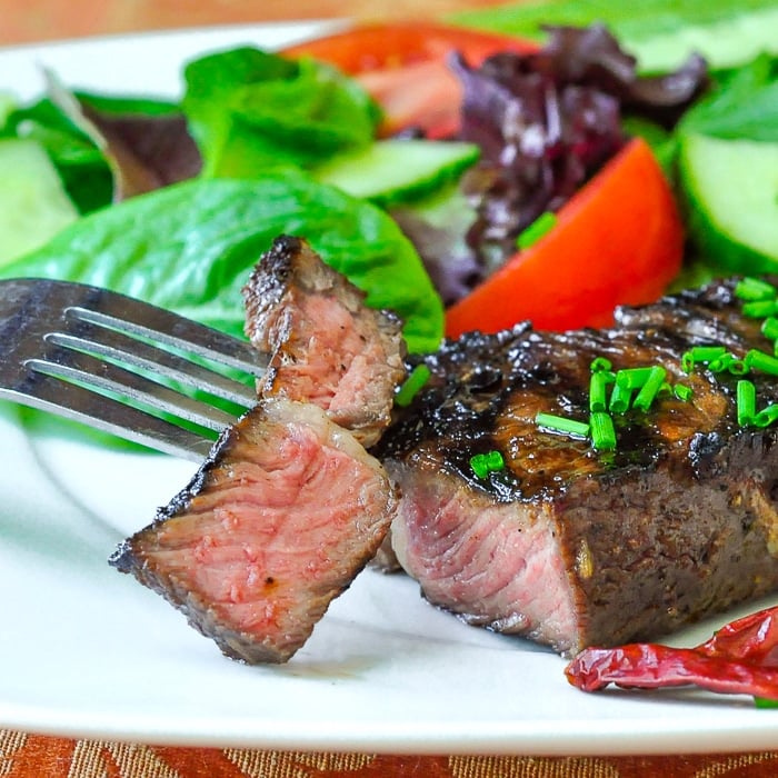 Garlic and Five Spice Grilled Steak close up photo of cut steak