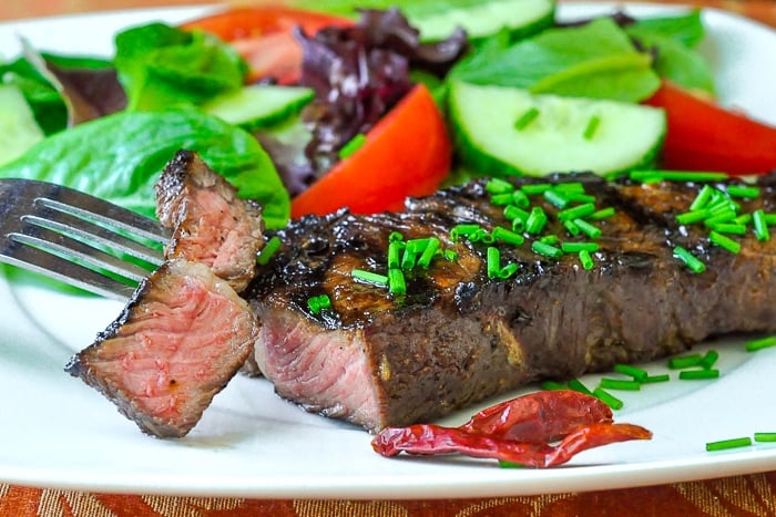 Garlic and Five Spice Grilled Steak shown with a side salad