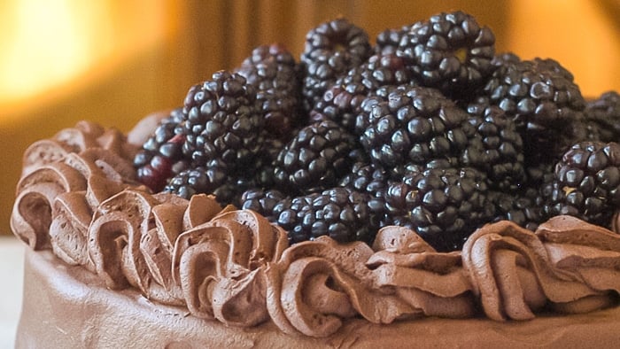 Rum Truffle Cake photo of blackberries garnishing the top of the cake