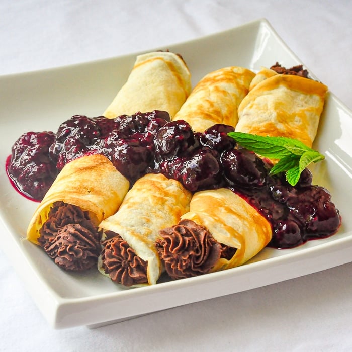 Photo of 3 Chocolate Crepes on a white serving platter