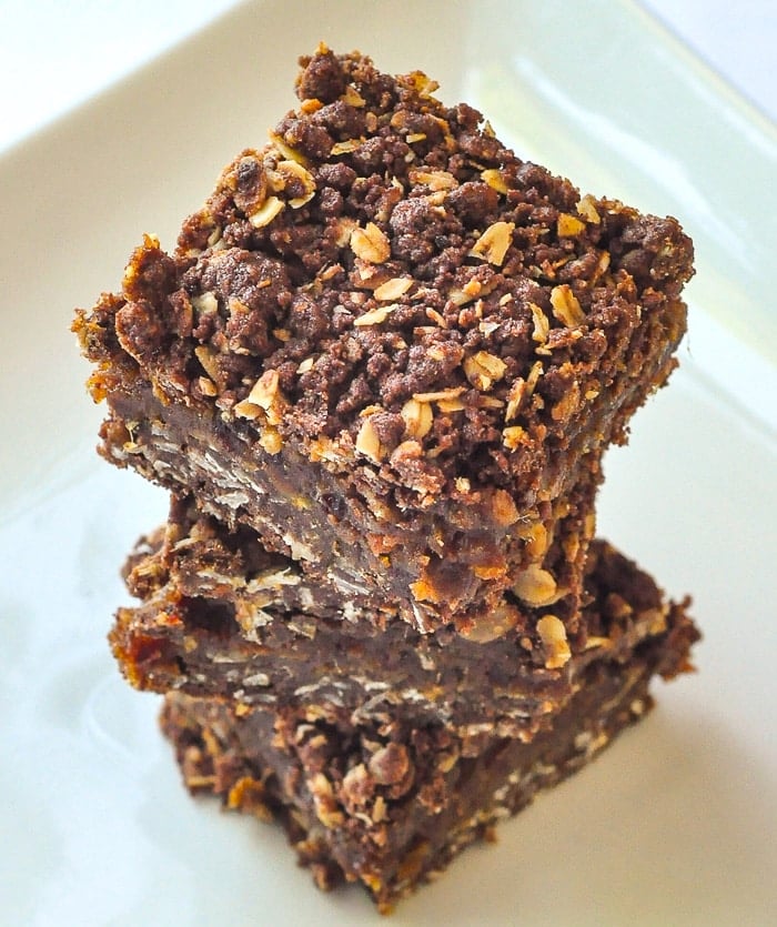 Chocolate Orange Date Crumbles photo of cookie squares stacked on a white platter