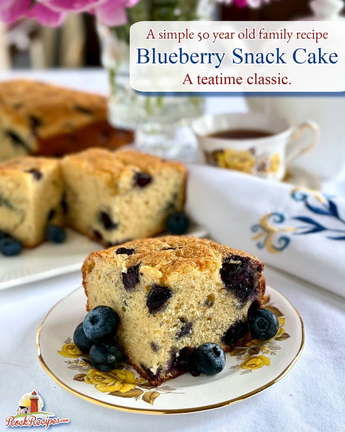 Photo of blueberry snack cake with tea service in the background and title Text Plus Rock recipes logo added for social media posts and Pinterest