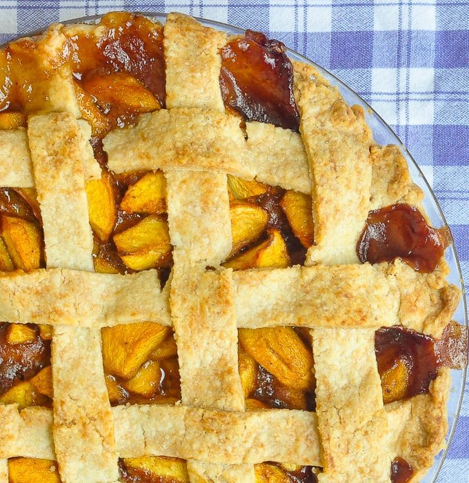 Peach pie overhead close up photo of uncut pie