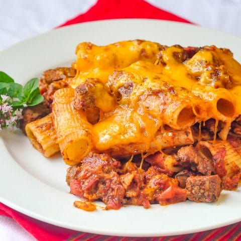 Cheesy Steak & Bacon Baked Pasta closw up image of single serving on a white plate