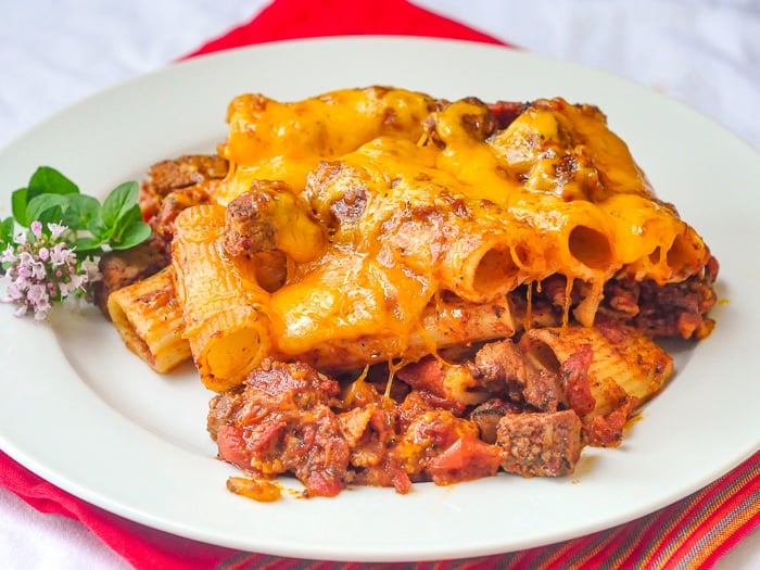 Cheesy Steak & Bacon Pasta Bake wide shot of entire serving on a white plate