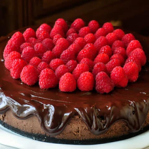 Chocolate Mousse Cheesecake close up shot of dripping chocolate ganache.