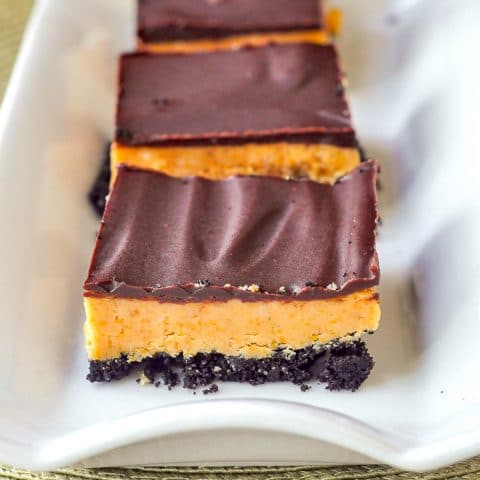 Oreo Peanut Butter Bars close up image on white serving plate