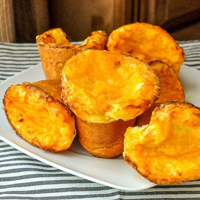 Cheddar Yorkshire Pudding Parmesan Popovers on a white plate