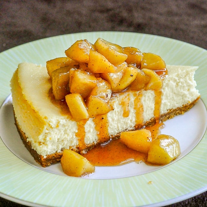 Maple Apple Cheesecake showing a single slice on green plate