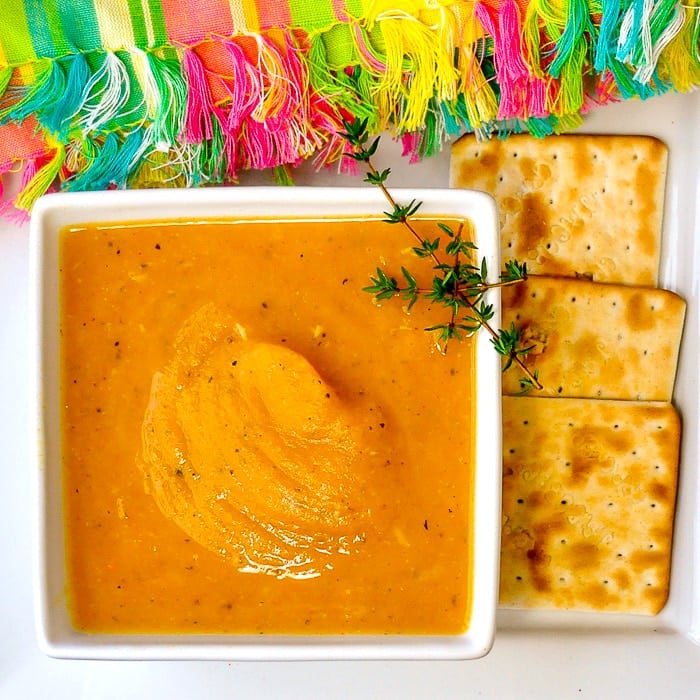 Roasted Pumpkin Soup overhead shot of single bowl of soup with crackers