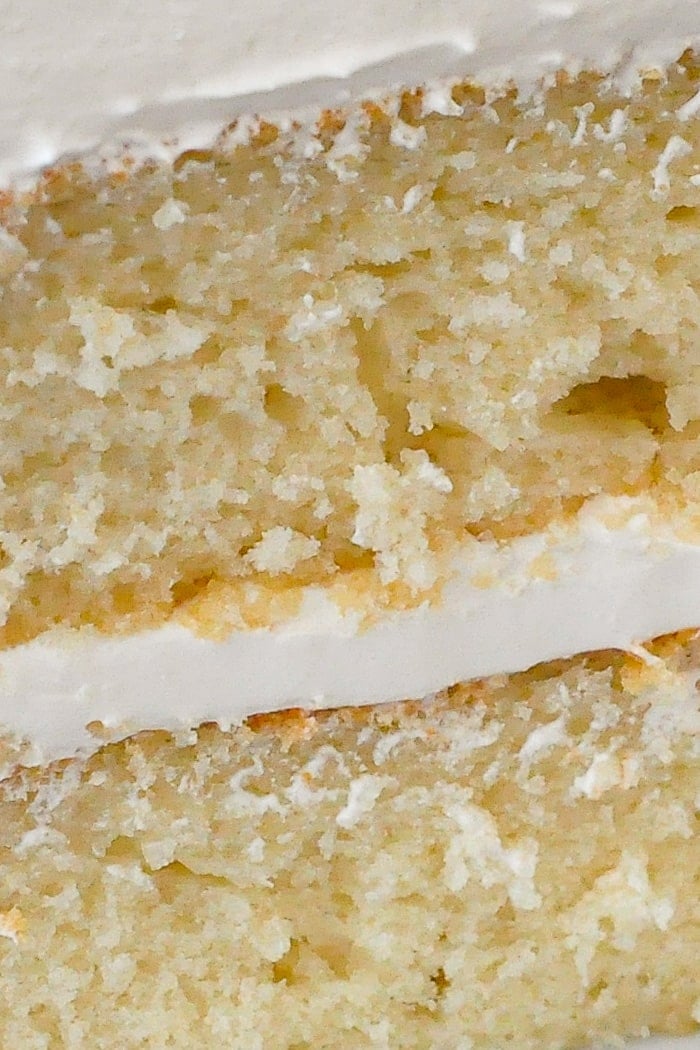 White Velvet Cake close up photo of one slice showing the moist crumb structure