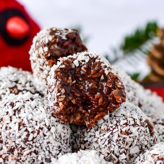 Close up of Newfoundland Snowballs with one cut in half to show the inside with title text added for Pinterest