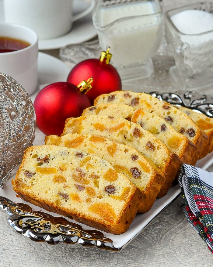 Apricot Raisin Cake, shown with a tea service and red Christmas tree balls.