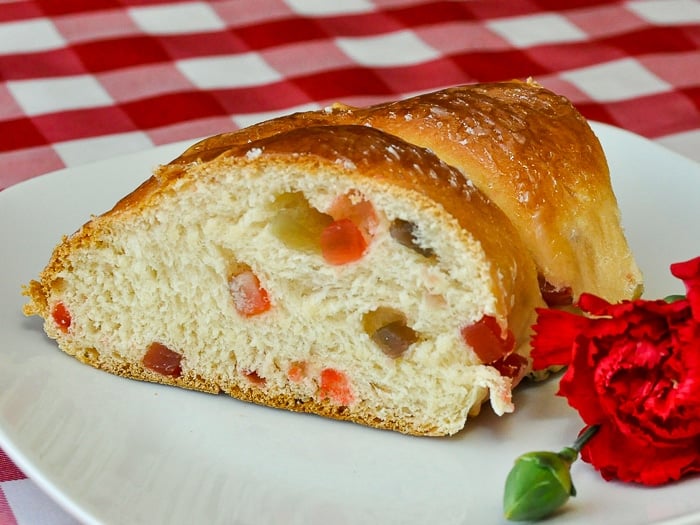 Christmas Fruit Bread shown as a slice of the wreath